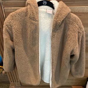 Ugg like sweater.  Chestnut exterior cream interior.